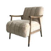 Rauma Chair upholstered in lambswool fabric with washed oak frame, light natural tones, and nickel-capped legs, modern country style.